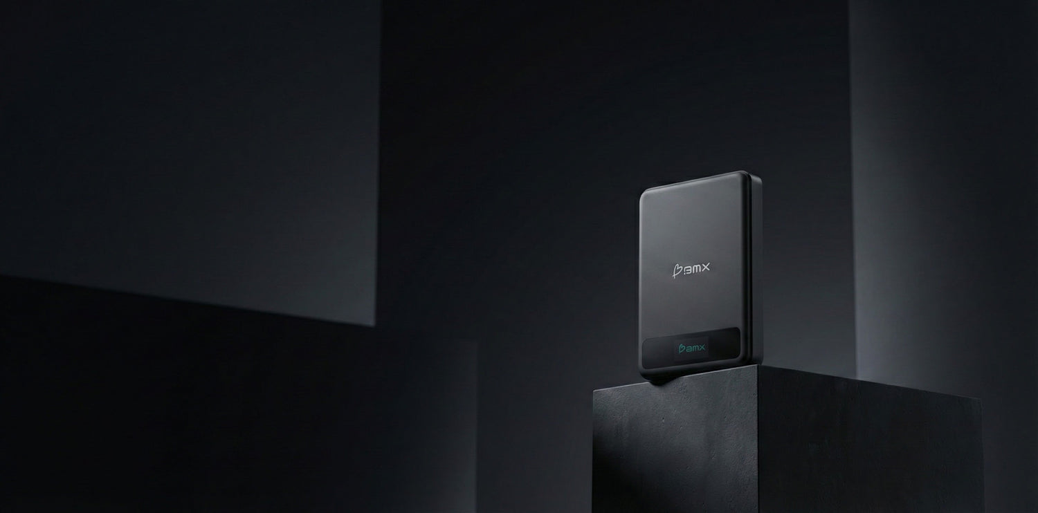 Minimalist product shot of a BMX power bank on a dark pedestal.