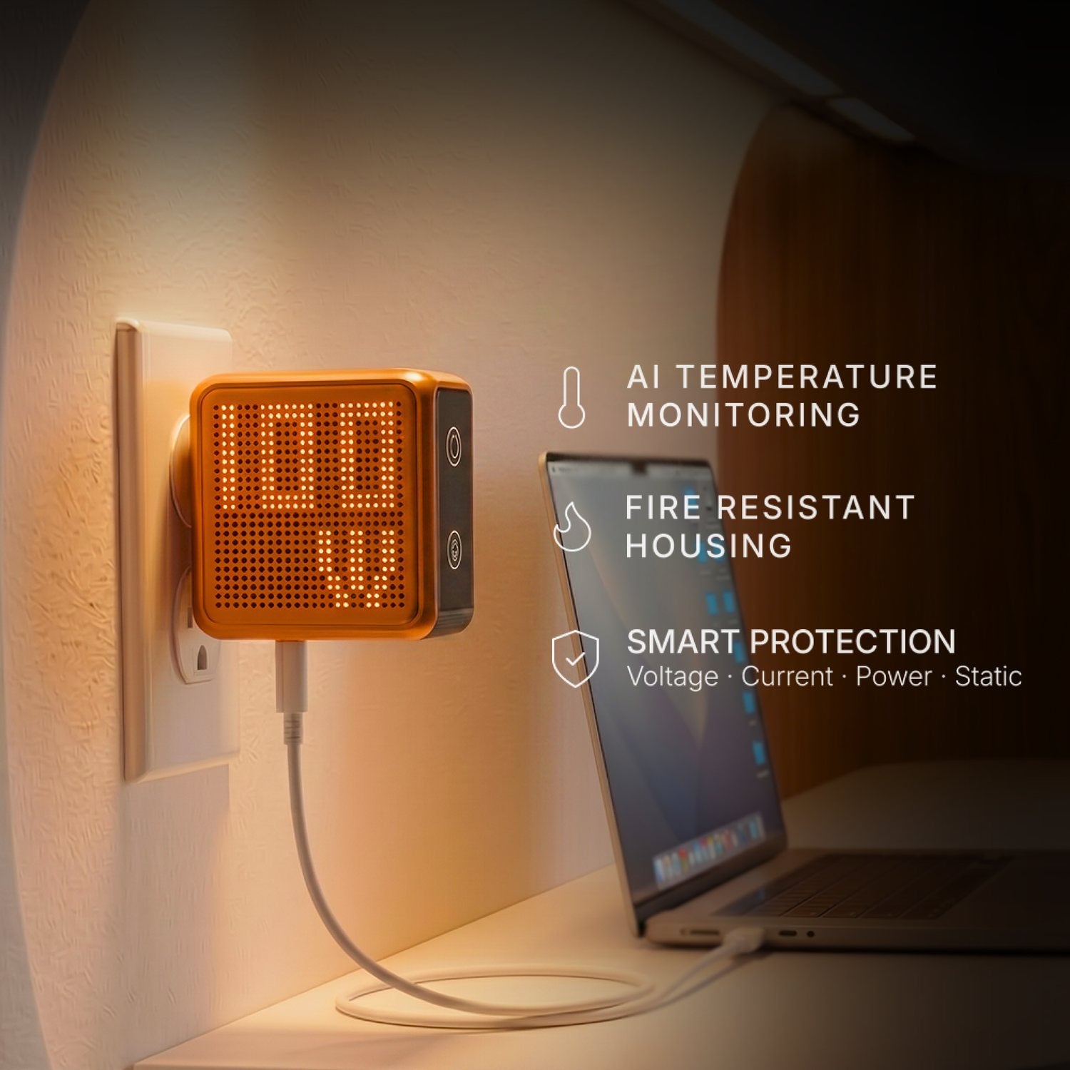GaNsta Pixel plugged in with protection icons beside a laptop